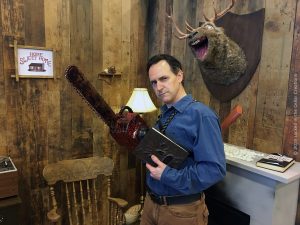 Brian cosplaying as Ash Williams in the Evil Dead Cabin Replica